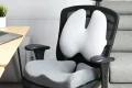 Photo by namibian.com.na - Lumbar Support Pillow vs Built-In Lumbar Adjustment in Office Chairs