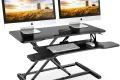 Photo by storage.googleapis.com - Standing Desk Converter for Dual Monitor Setups: Sizing and Weight Limits
